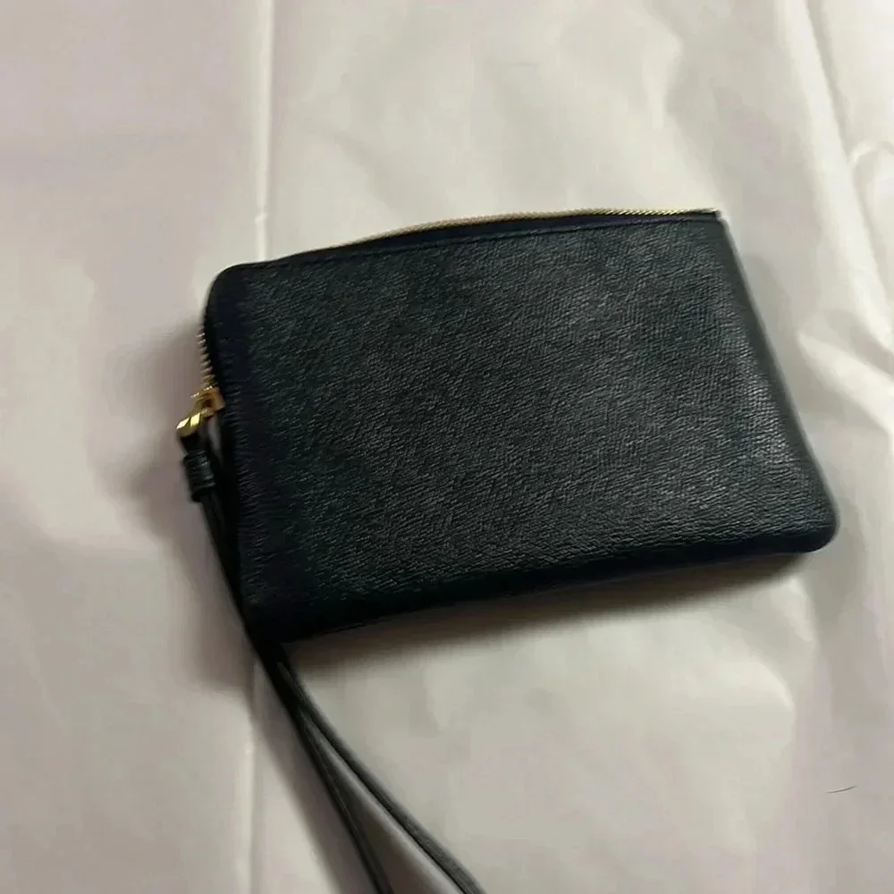 NWT Coach cross grain leather corner zip wristlet.